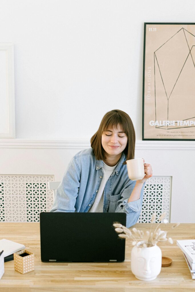 woman using her laptop for print on demand services 